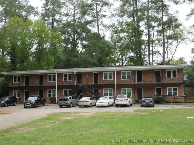 a view of a yard and front view of a house