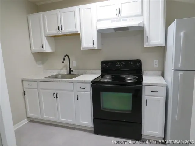 a white toilet sitting next to a bath tub