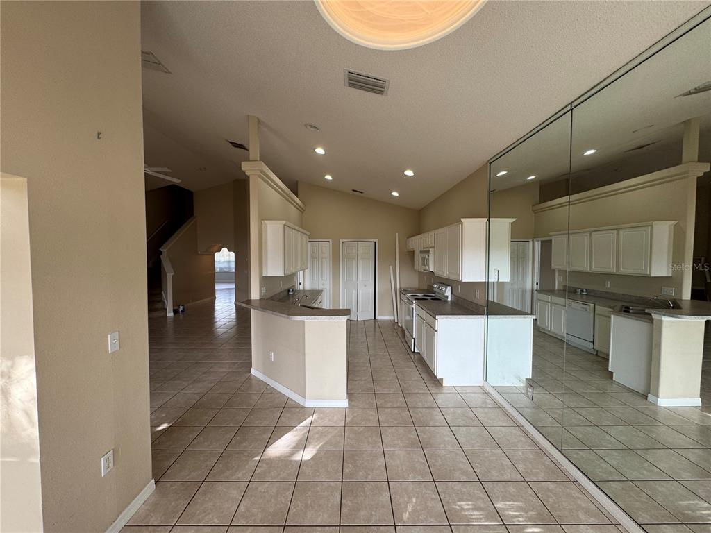 4190 Bear Gully Road Winter Park, FL 32792 - Photo 11 of 30 a kitchen with a sink and cabinets