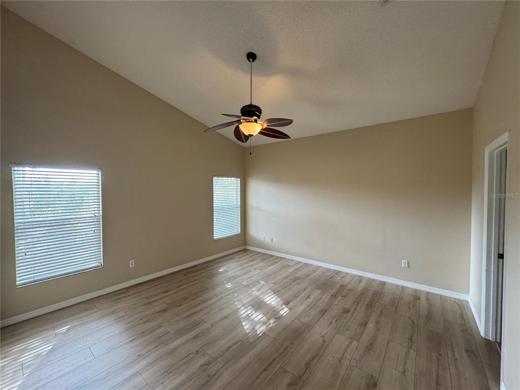 4190 Bear Gully Road Winter Park, FL 32792 - Photo 14 of 30 wooden floor in an empty room with a window