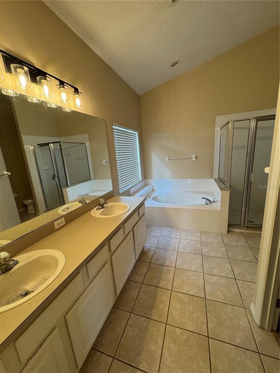 4190 Bear Gully Road Winter Park, FL 32792 - Photo 16 of 30 a bathroom with a sink a toilet and mirror