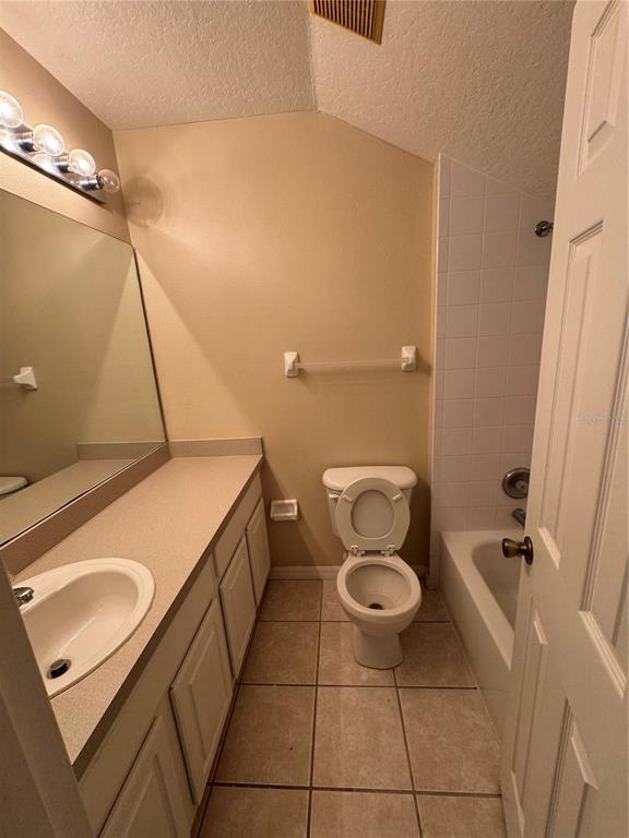 4190 Bear Gully Road Winter Park, FL 32792 - Photo 21 of 30 a bathroom with a granite countertop sink toilet and shower