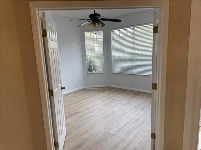 a view of an empty room with a window