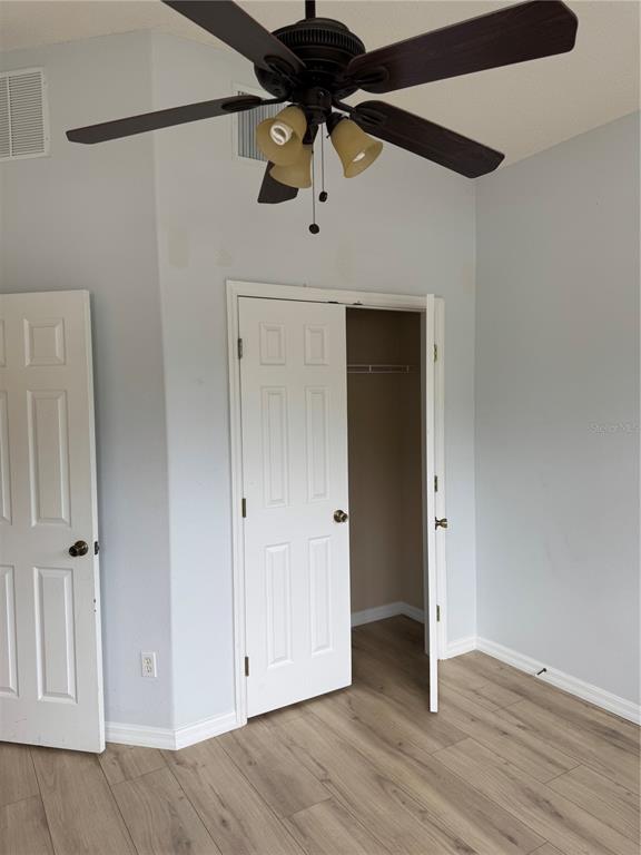 4190 Bear Gully Road Winter Park, FL 32792 - Photo 4 of 30 a view of an empty room with wooden floor