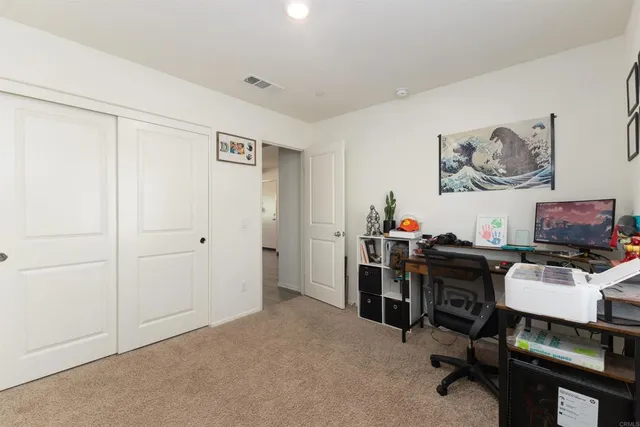 a view of a workspace with furniture