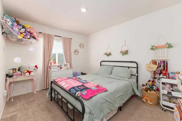 a bedroom with bed and a window