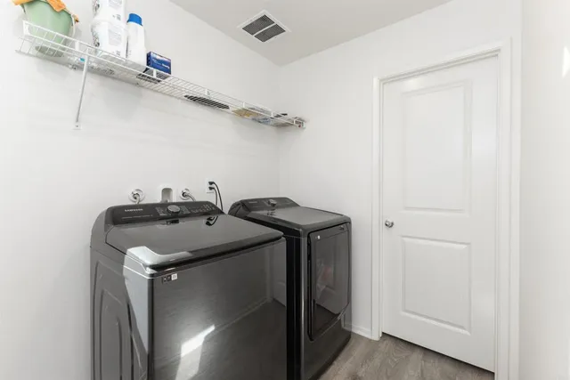 a utility room with dryer and washer