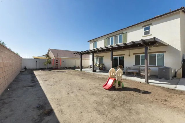 a house view with a backyard space