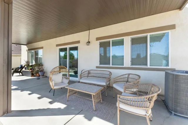 a outdoor space with patio the couches and a dining table with chair