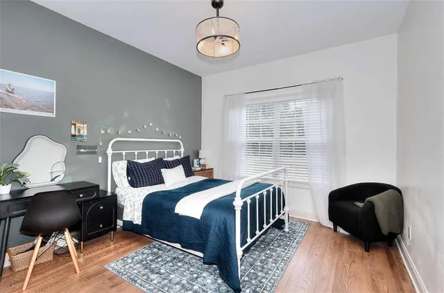 a bathroom with a sink vanity mirror and toilet