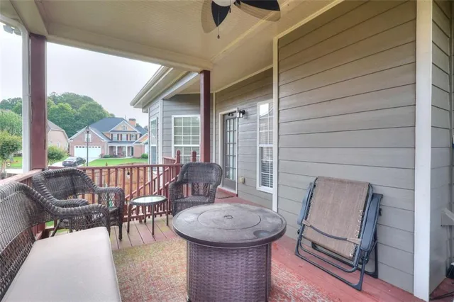 a living room with furniture and a rug