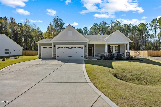 a view of a house with couches in front of house
