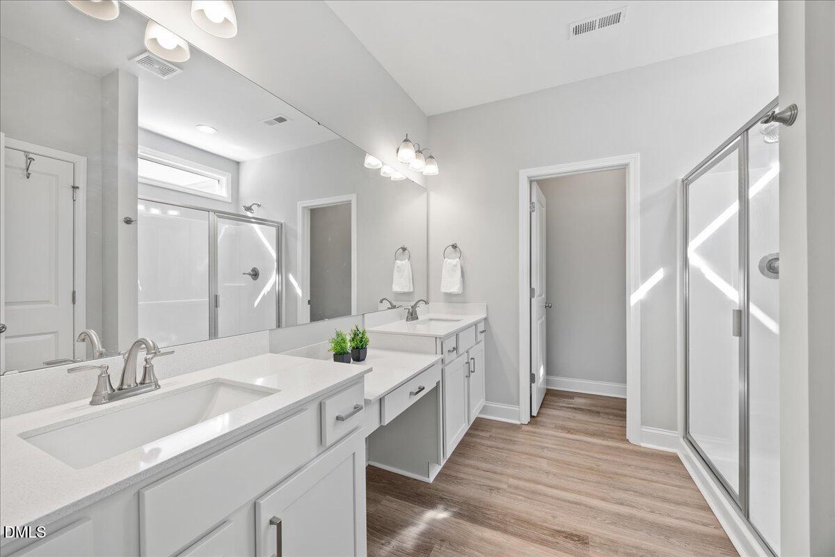 189 Red River Drive Selma, NC 27576 - Photo 19 of 31 a spacious bathroom with a double vanity sink mirror and double