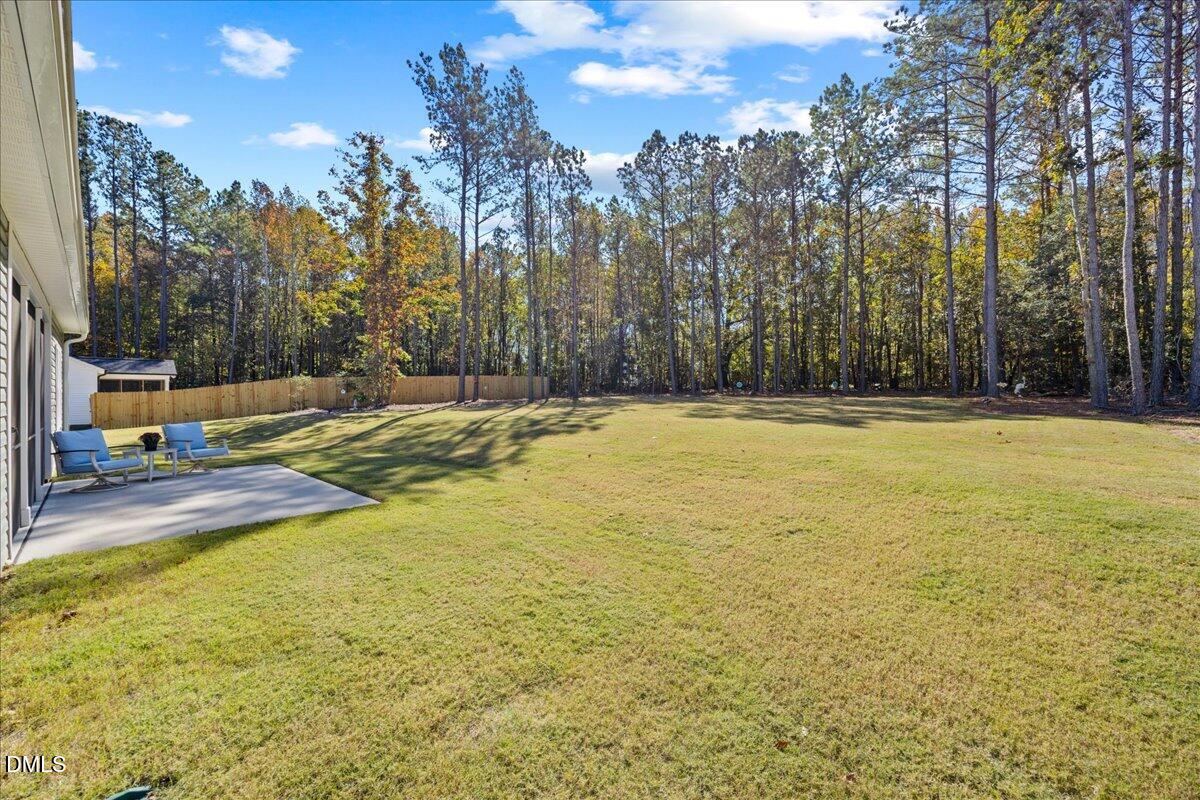 189 Red River Drive Selma, NC 27576 - Photo 27 of 31 a view of a swimming pool with an outdoor space and seating area