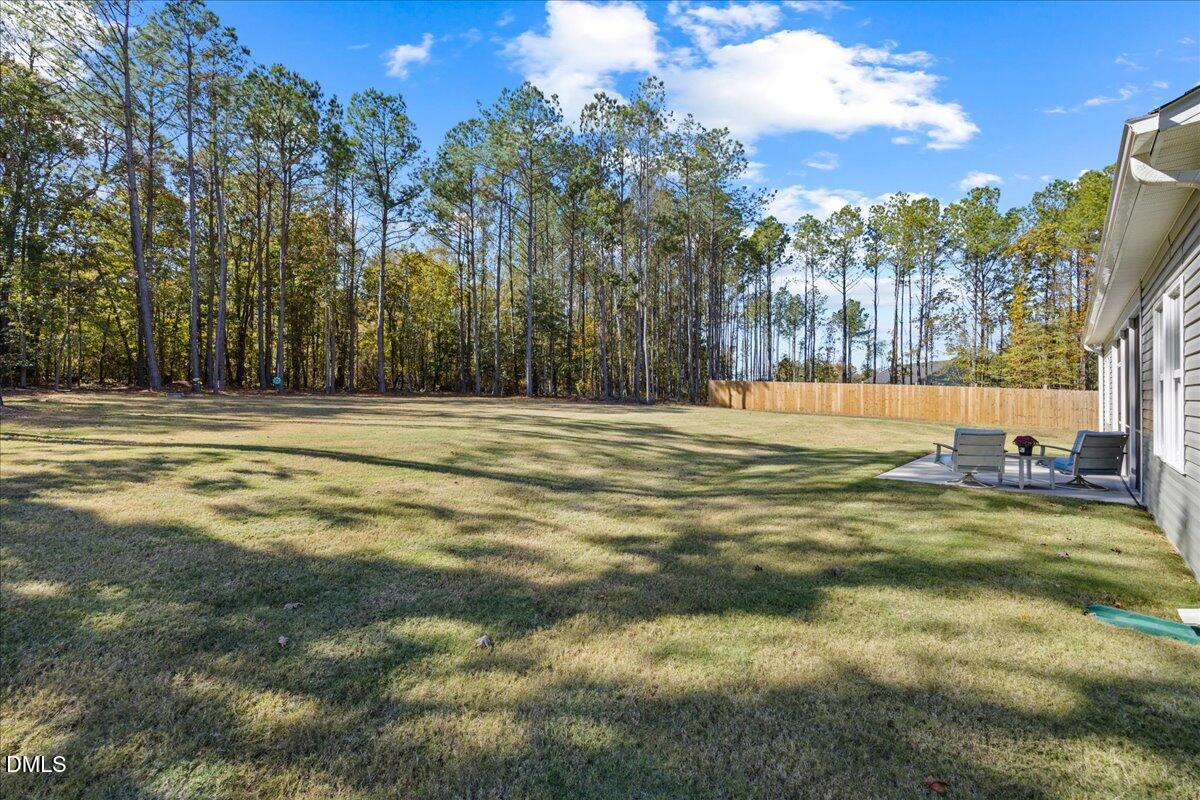 189 Red River Drive Selma, NC 27576 - Photo 29 of 31 a view of a swimming pool with an outdoor space and seating area