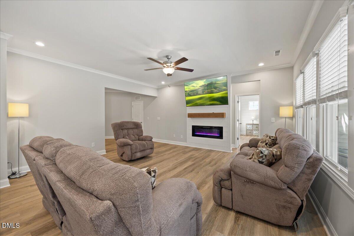 189 Red River Drive Selma, NC 27576 - Photo 5 of 31 a living room with furniture fireplace and a large window