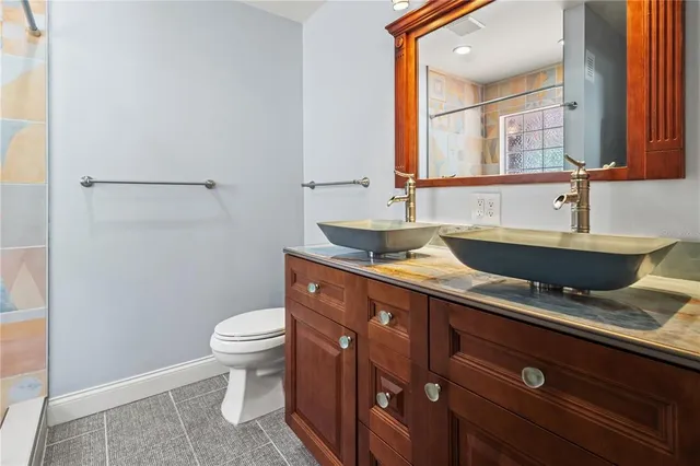 a bathroom with a bathtub and a toilet