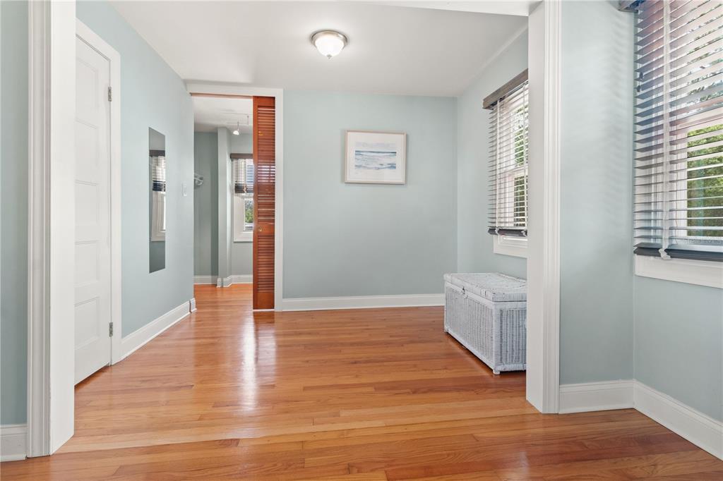 6515 Dimarco Road Tampa, FL 33634 - Photo 21 of 67 a view of an empty room with wooden floor and a window