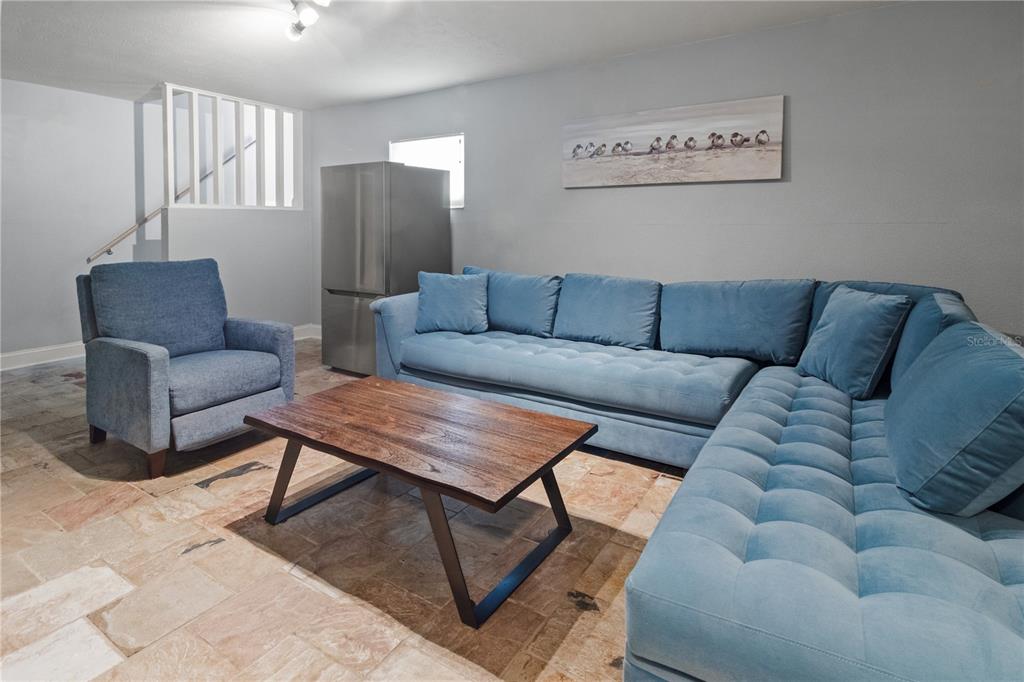 6515 Dimarco Road Tampa, FL 33634 - Photo 25 of 67 a living room with furniture and a couch