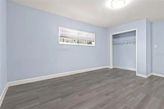 a kitchen with stainless steel appliances granite countertop a sink a stove and a microwave