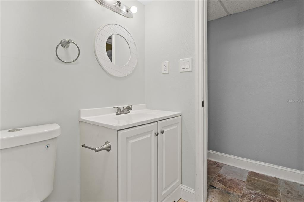 6515 Dimarco Road Tampa, FL 33634 - Photo 35 of 67 a bathroom with a sink and a mirror