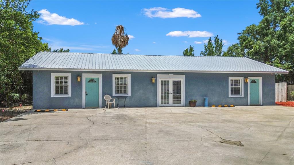 6515 Dimarco Road Tampa, FL 33634 - Photo 38 of 67 a front view of a house with a yard