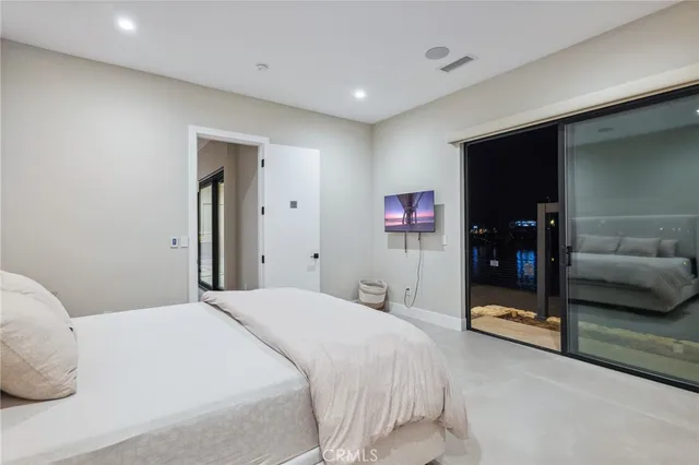 a bedroom with a bed and a couch