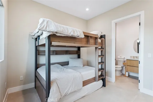 a bedroom with a bed and a view of bathroom