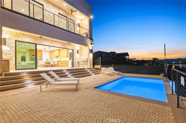 a view of swimming pool with seating area