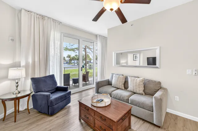 a living room with furniture a large window with outer view
