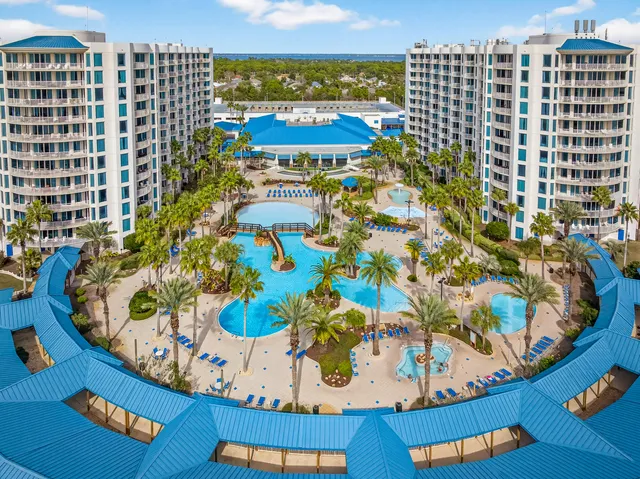 a view of swimming pool with outdoor seating and city view