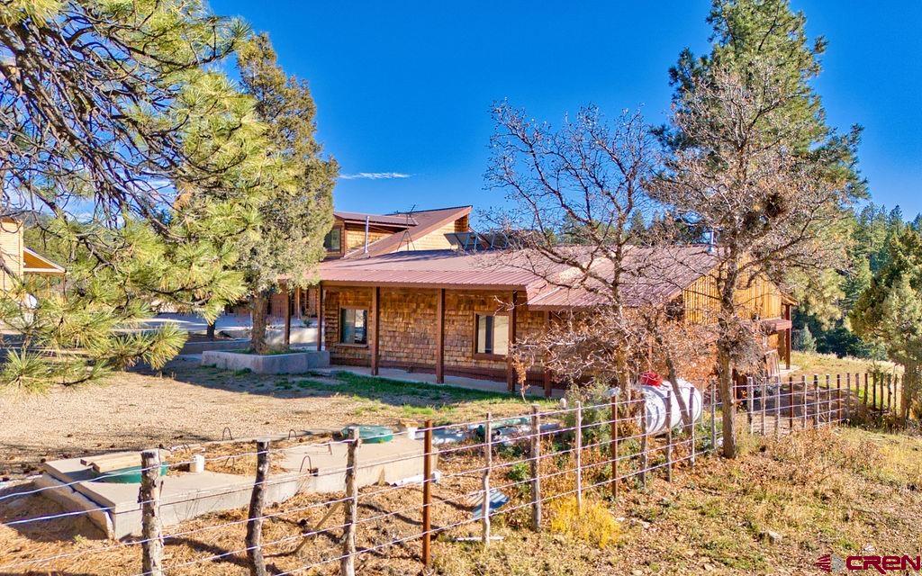44750 Rd L Mancos, CO 81328 - Photo 12 of 45 a view of a house with a yard