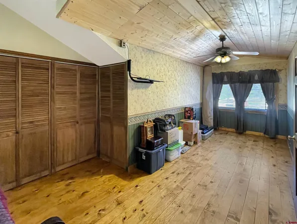 a kitchen with a stove a refrigerator and cabinets