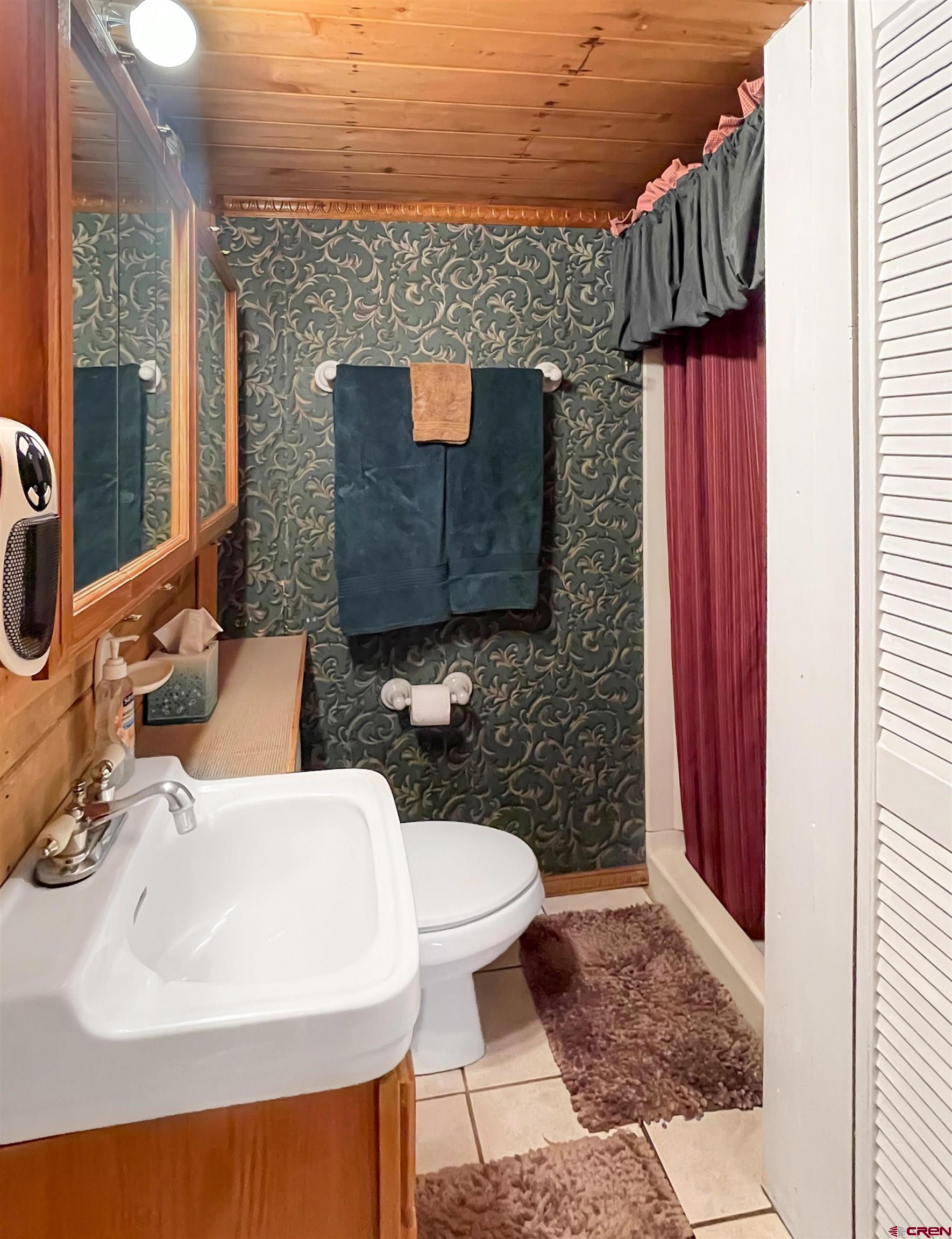 44750 Rd L Mancos, CO 81328 - Photo 20 of 45 a bathroom with a sink a toilet and a mirror