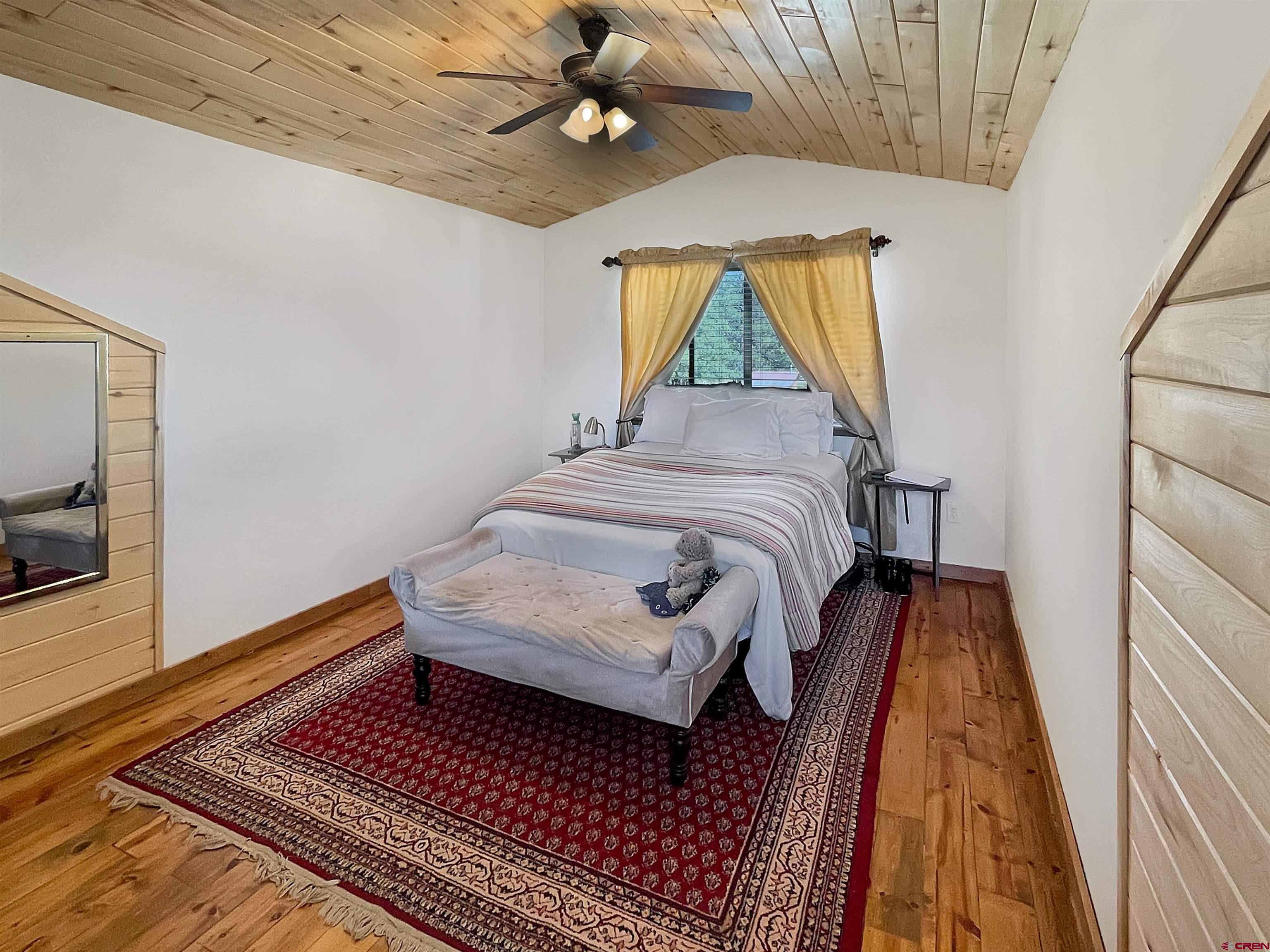 44750 Rd L Mancos, CO 81328 - Photo 22 of 45 a bedroom with bed and a window