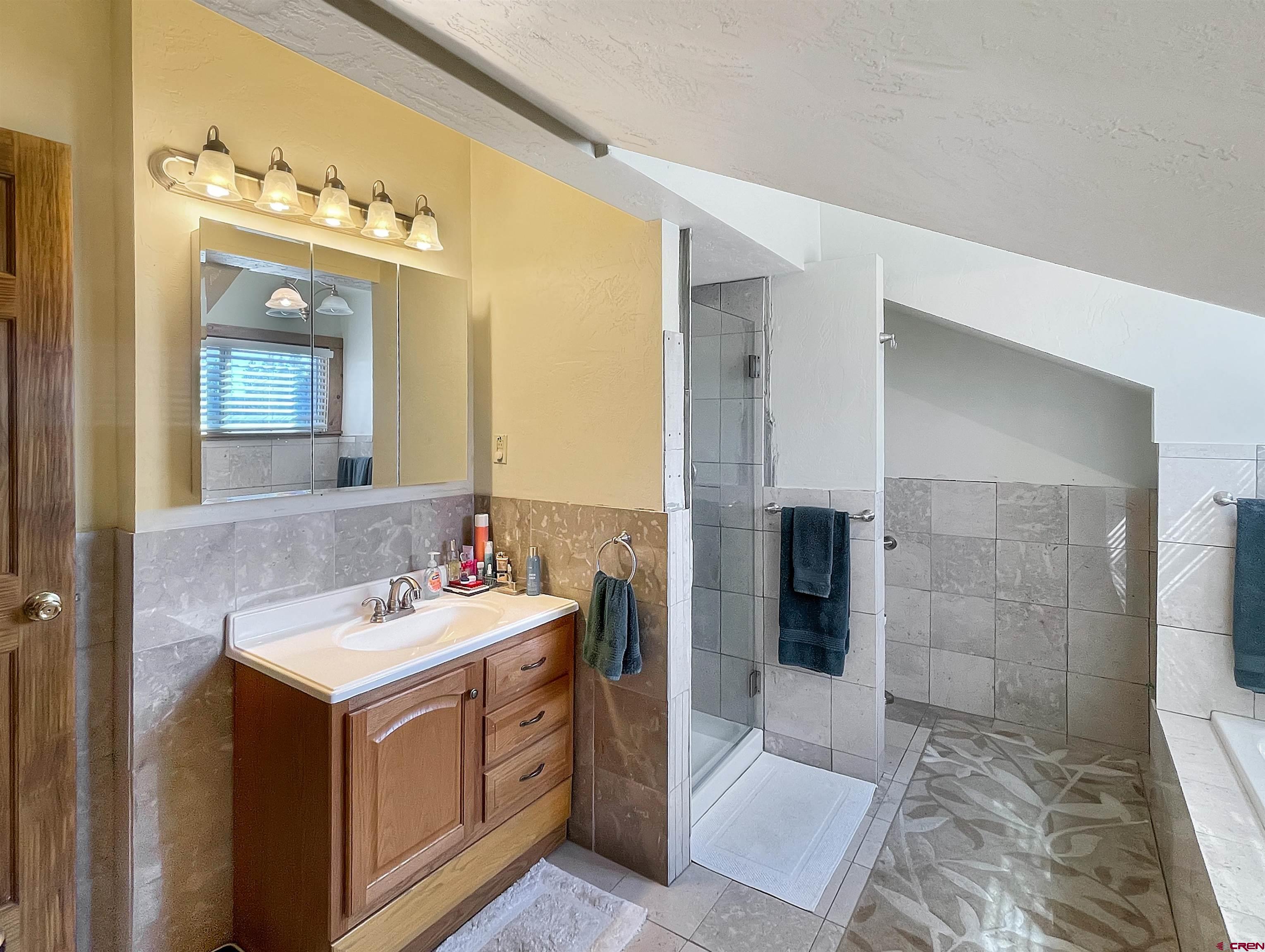 44750 Rd L Mancos, CO 81328 - Photo 25 of 45 a bathroom with a sink and a mirror