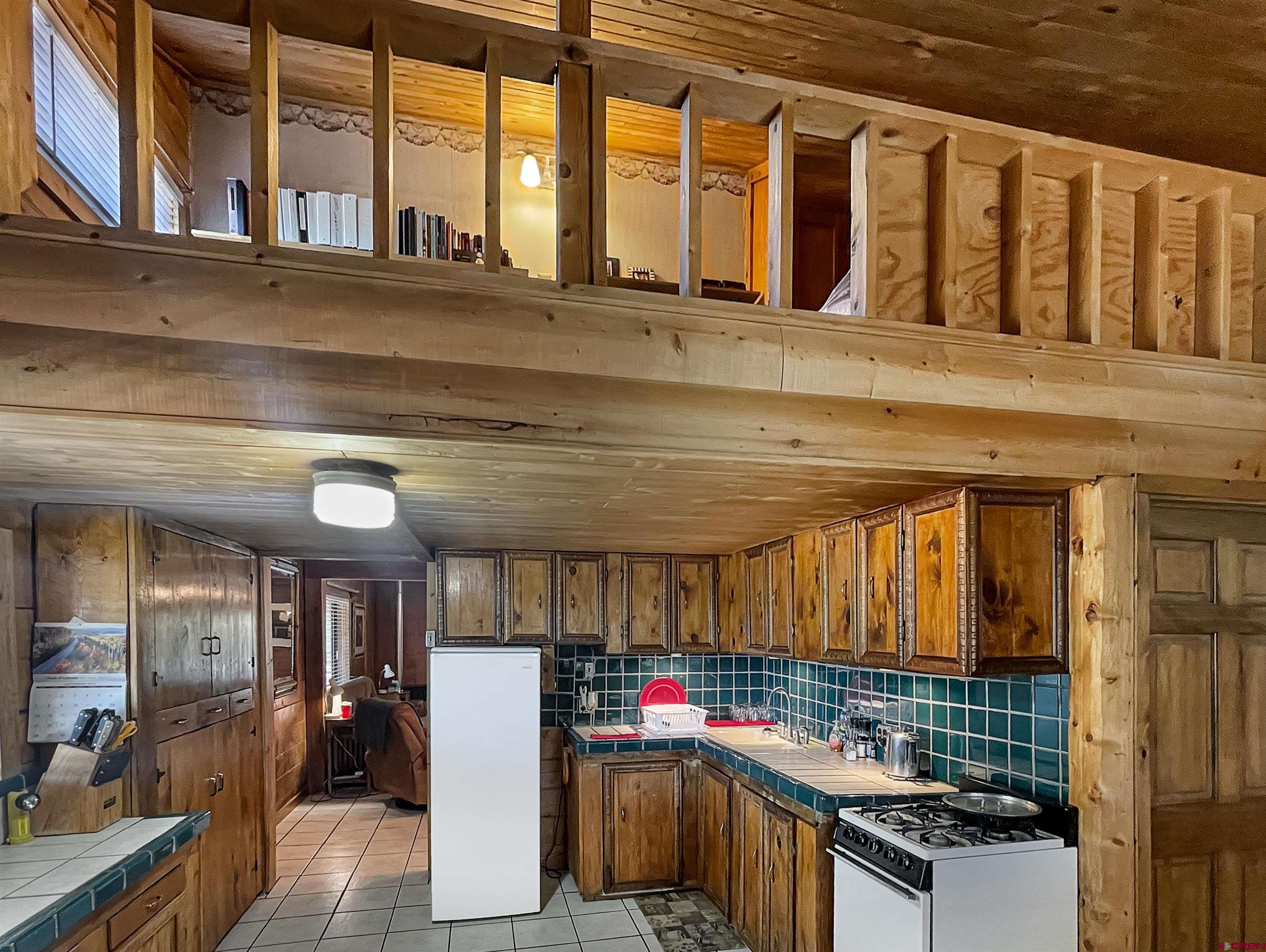 44750 Rd L Mancos, CO 81328 - Photo 3 of 45 a kitchen with stainless steel appliances granite countertop a stove and cabinets
