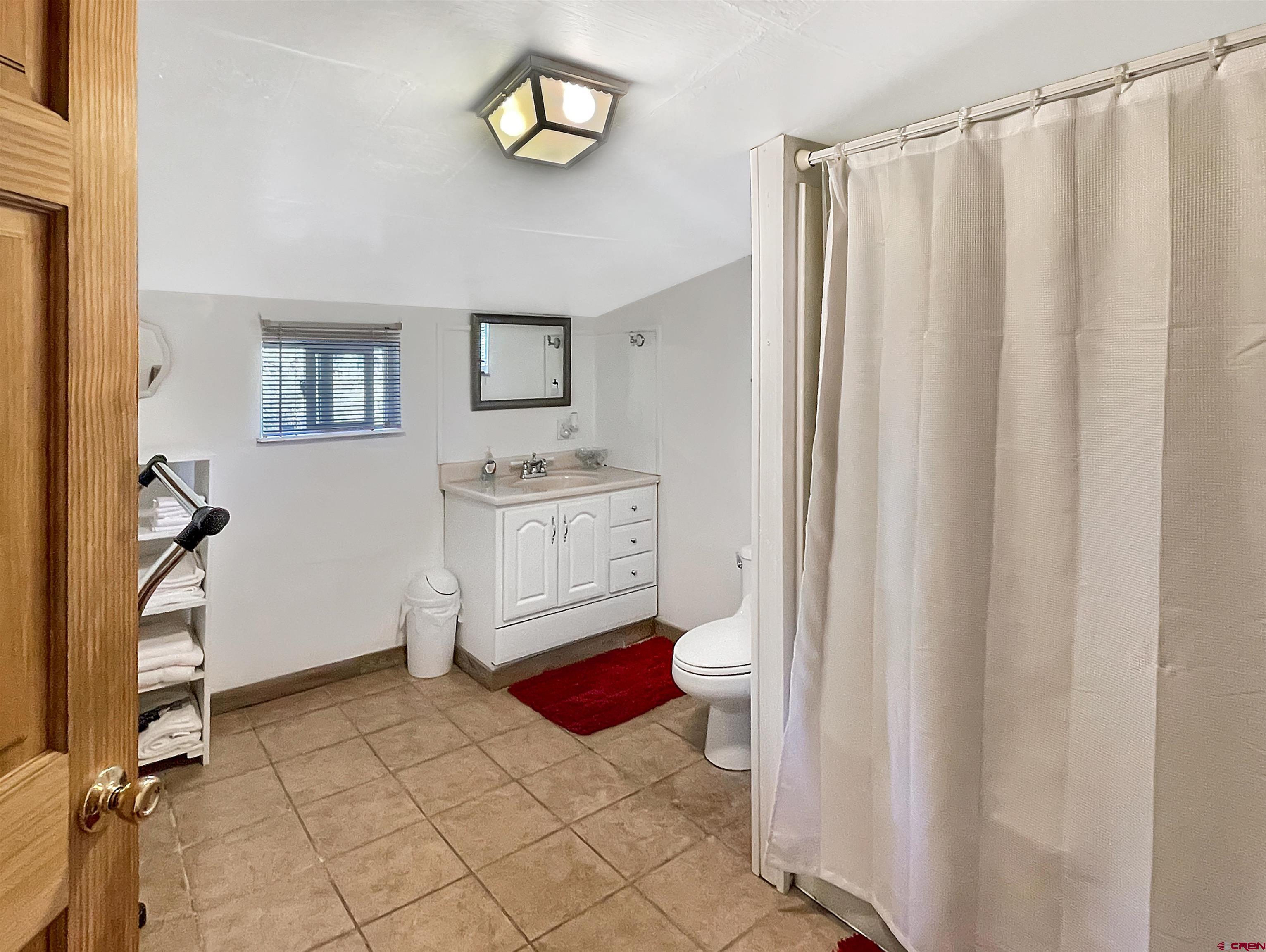 44750 Rd L Mancos, CO 81328 - Photo 4 of 45 a bathroom with a sink toilet and shower