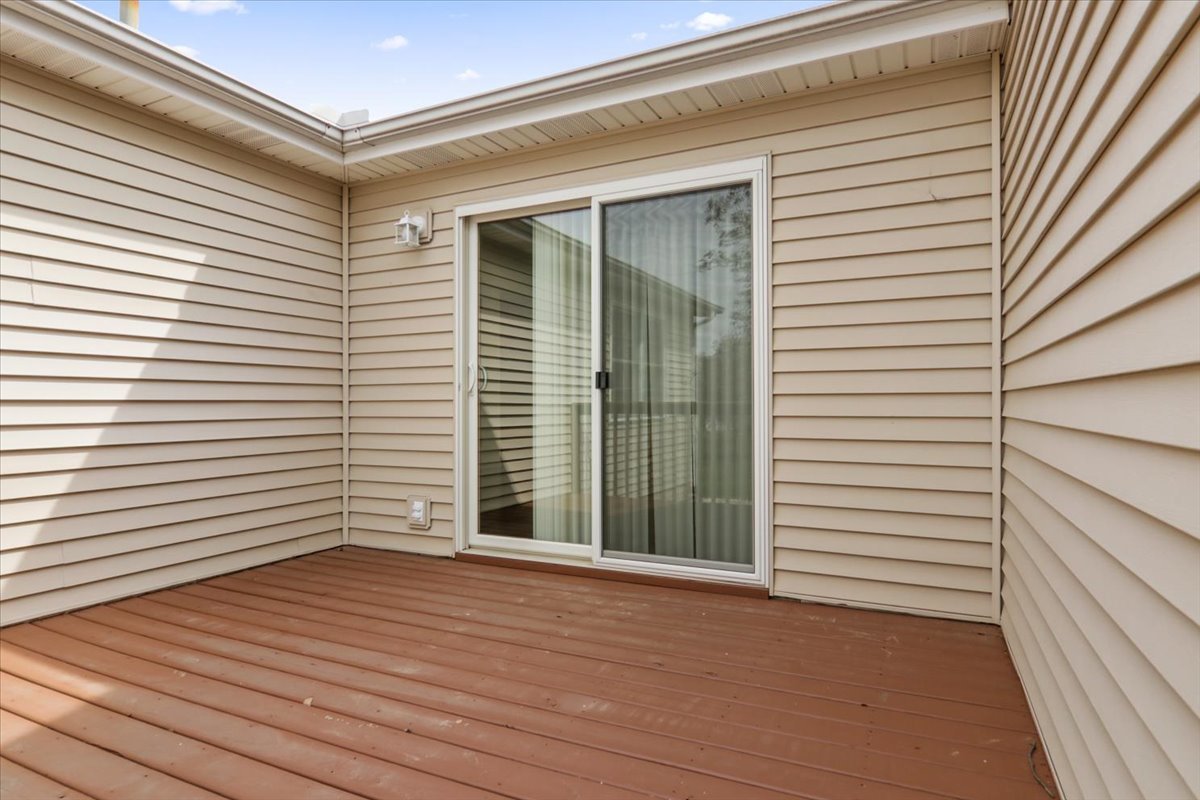 1707 Sunrise Point Normal, IL 61761 - Photo 7 of 23 a view of a house with wooden deck