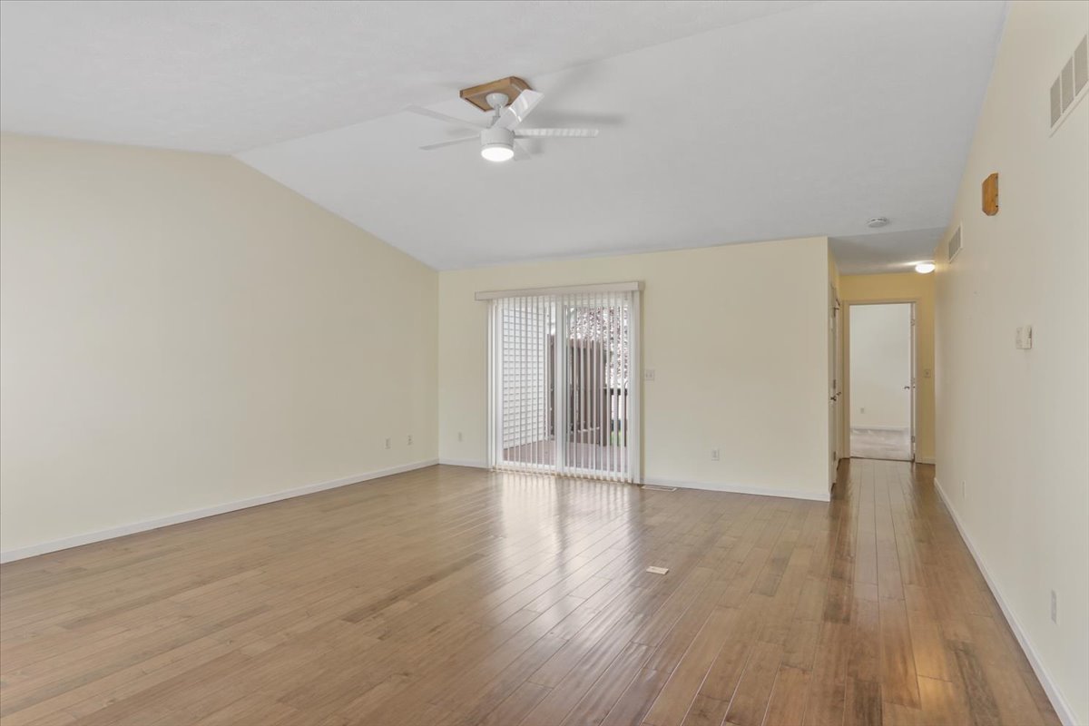 1707 Sunrise Point Normal, IL 61761 - Photo 8 of 23 wooden floor in an empty room with a window
