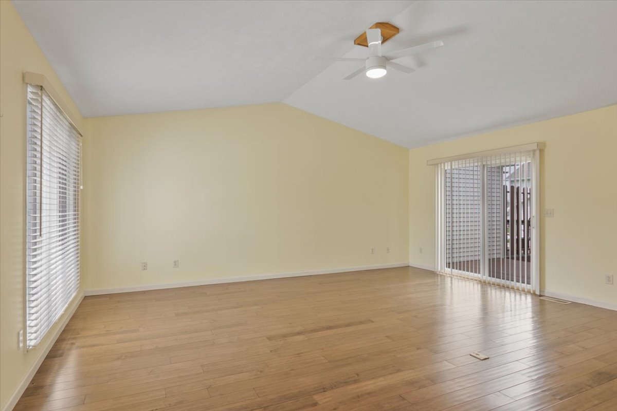 1707 Sunrise Point Normal, IL 61761 - Photo 10 of 23 wooden floor in an empty room with a window
