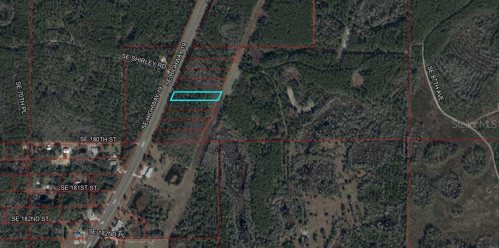 19 Southeast Inglis Inglis, FL 34449 - Photo 3 of 3 a view of house with a tree