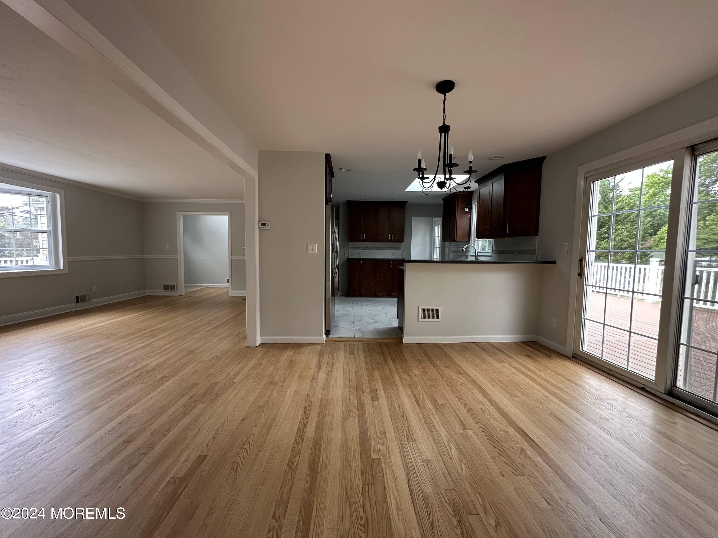 57 Kings Road Little Silver, NJ 07739 - Photo 7 of 22 a view of a room with wooden floor fireplace and windows
