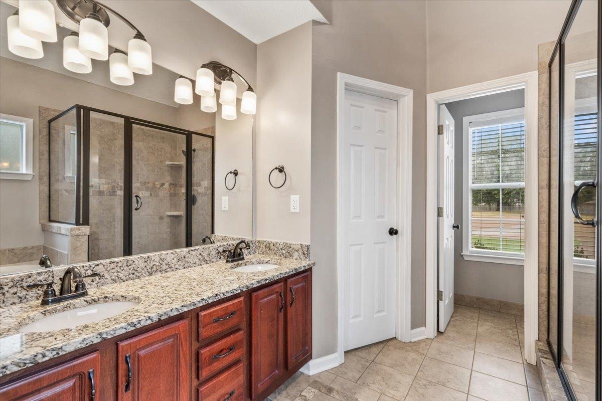 1279 River Ridge Drive Collierville, TN 38017 - Photo 14 of 28 a bathroom with a granite countertop sink and a mirror