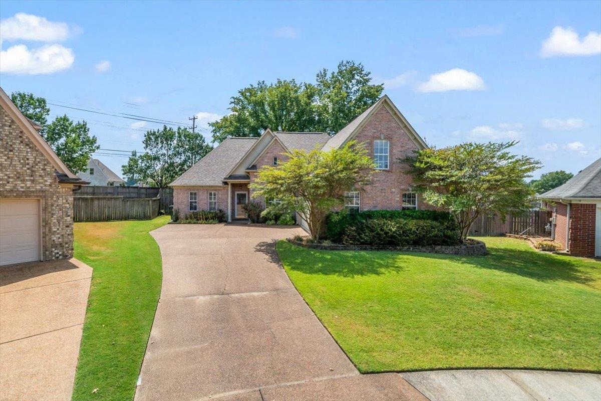 1279 River Ridge Drive Collierville, TN 38017 - Photo 2 of 28 a front view of house with yard and green space