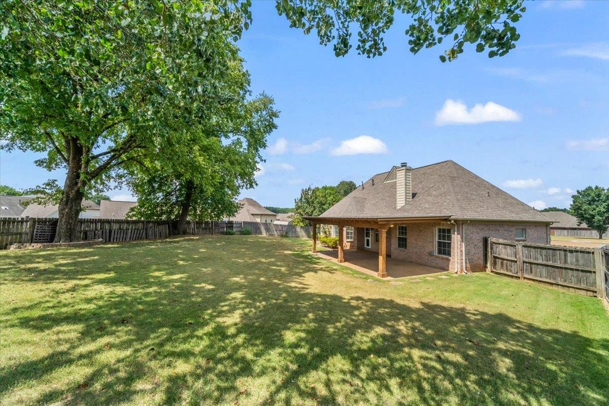 1279 River Ridge Drive Collierville, TN 38017 - Photo 23 of 28 a front view of a house with a yard