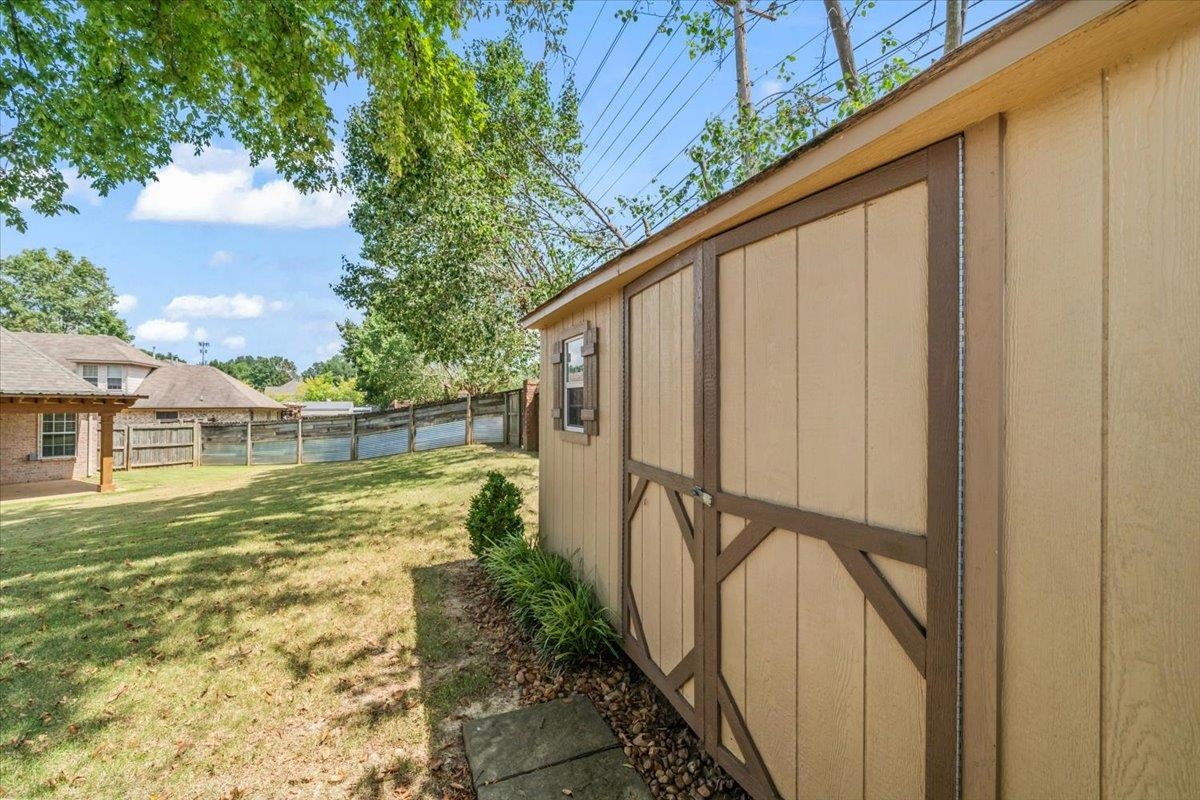 1279 River Ridge Drive Collierville, TN 38017 - Photo 24 of 28 a view of swimming pool with a yard