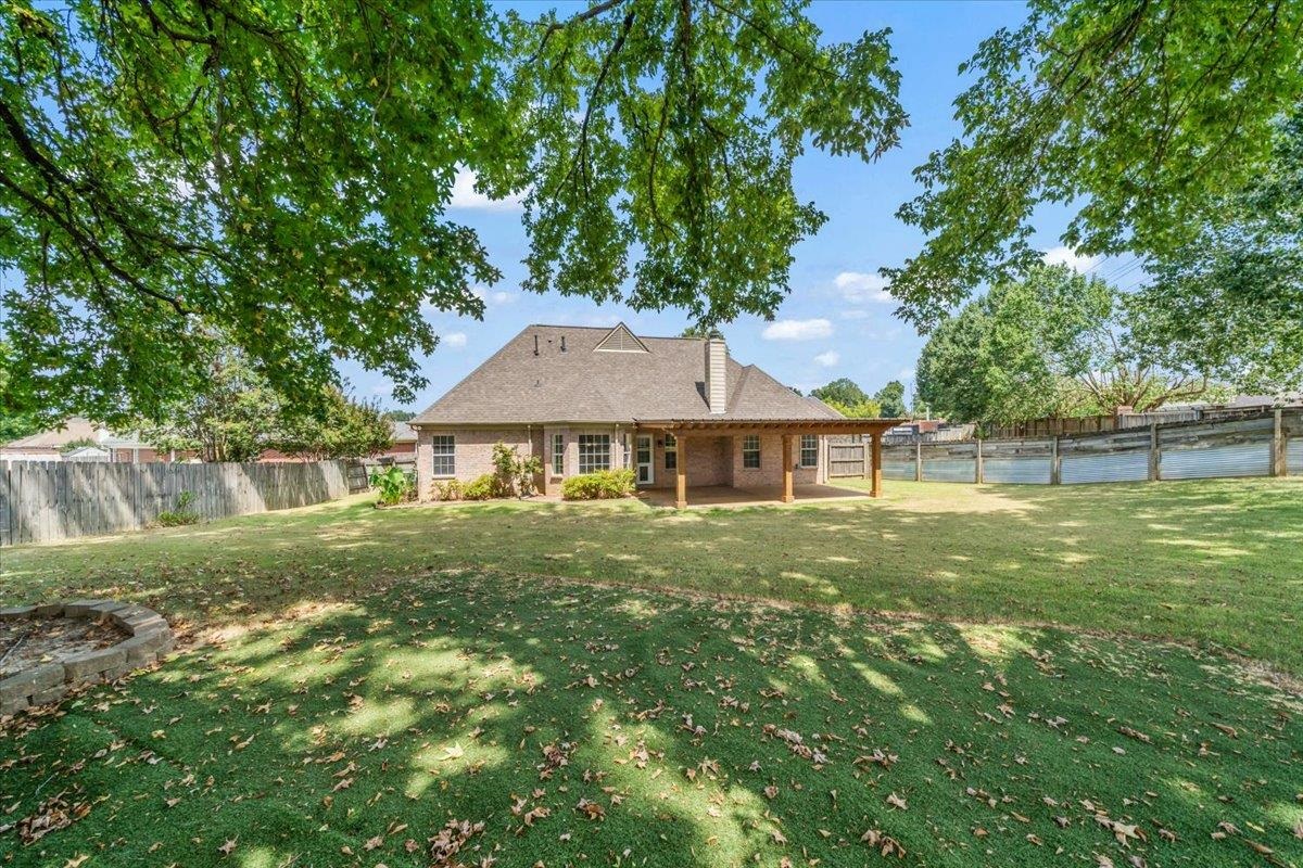 1279 River Ridge Drive Collierville, TN 38017 - Photo 25 of 28 a front view of a house with a yard