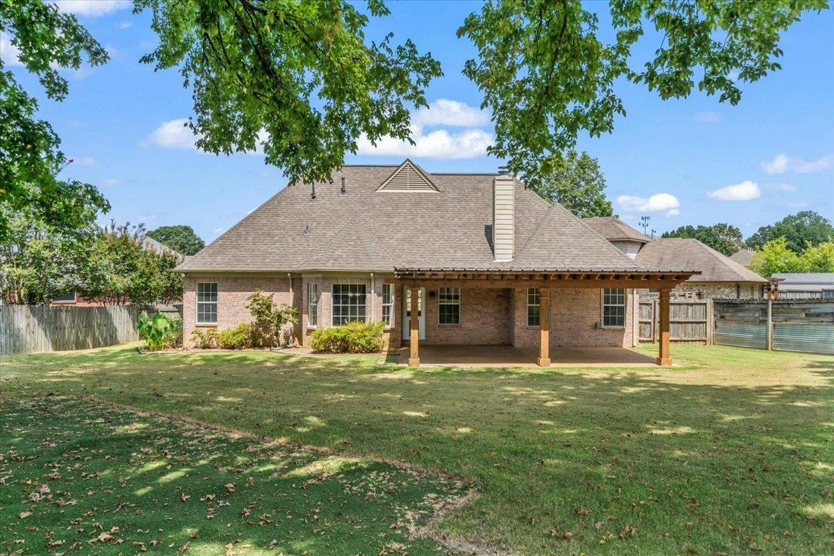 1279 River Ridge Drive Collierville, TN 38017 - Photo 26 of 28 a front view of a house with a garden