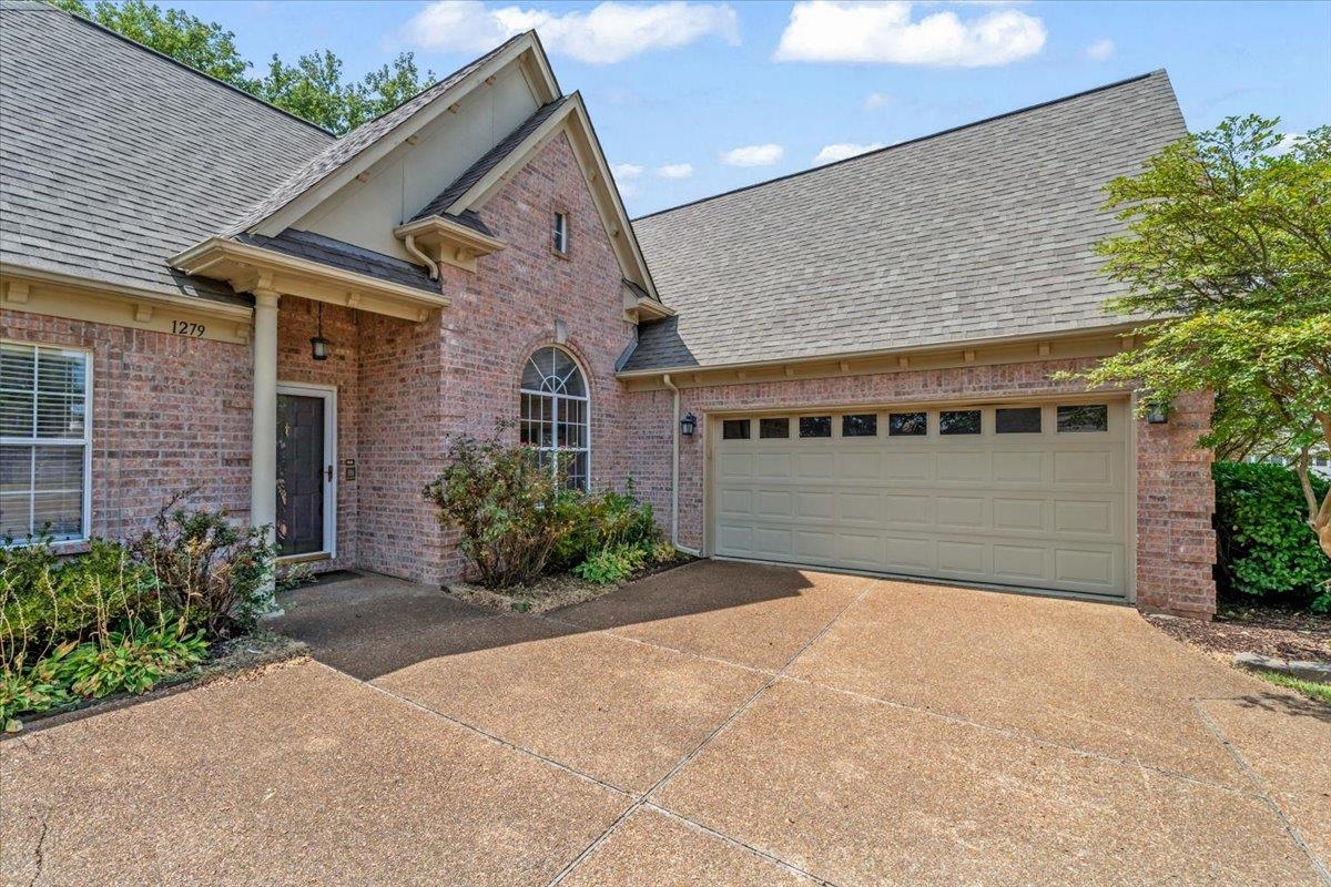 1279 River Ridge Drive Collierville, TN 38017 - Photo 3 of 28 a view of a house with a garage